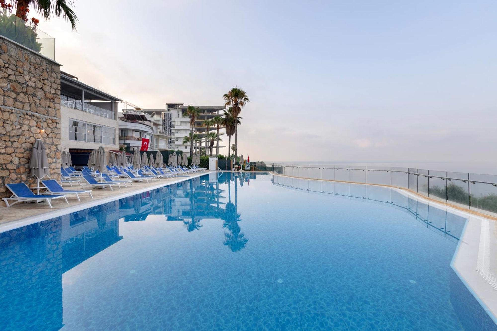 Ramada Plaza Antalya Hotel Exterior photo Infinity pool at a hotel in Crete, Greece