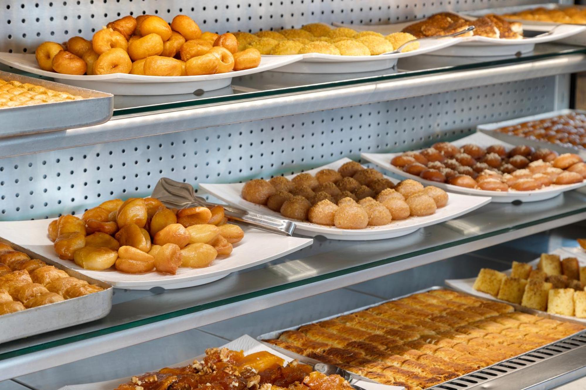 Ramada Plaza Antalya Hotel Exterior photo A display case of pastries